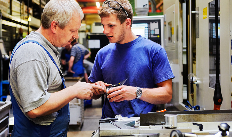 Two men in a manufacturing operations setting