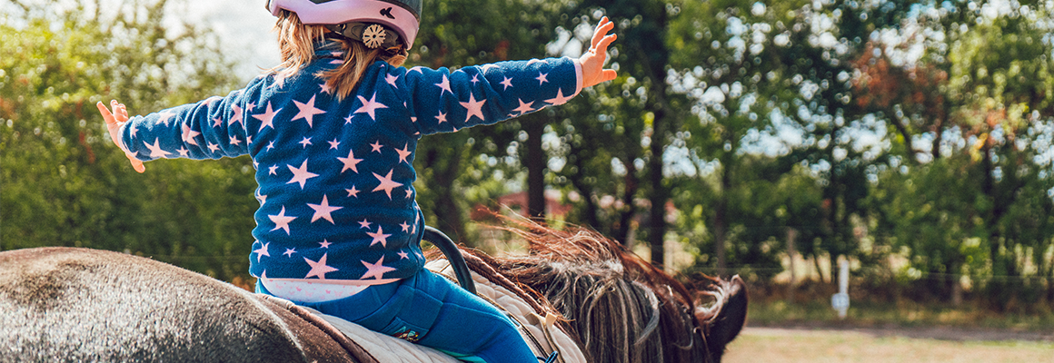 girl riding a horse courage
